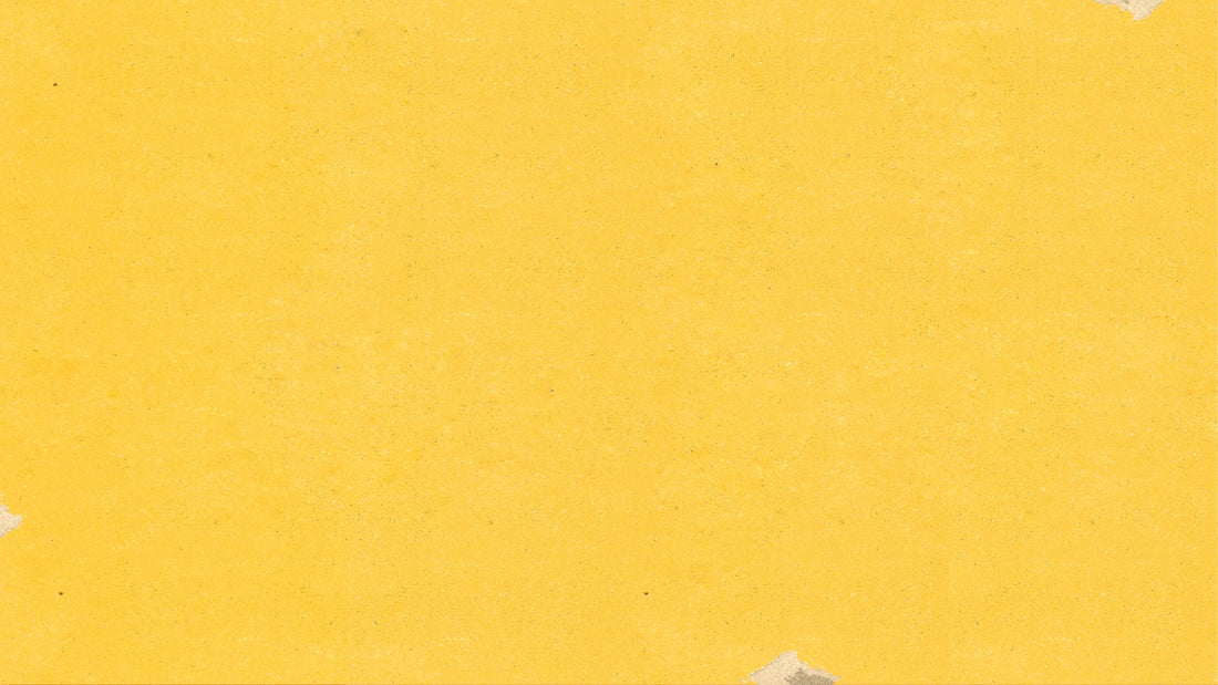 a piece of yellow paper with torn edges